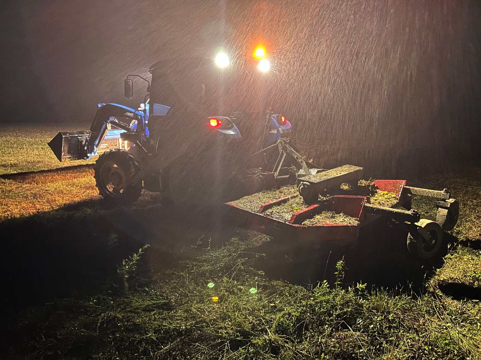 Ives tractor and mower clearing overgrown vegetation